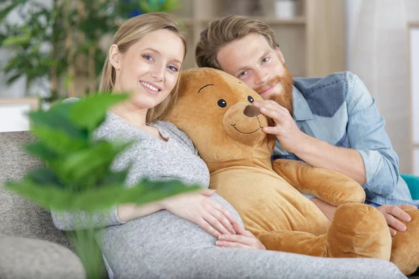 Pregnant Couple Chilling Sofa Teddy Bear — Stok fotoğraf