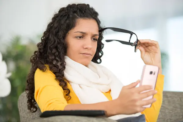 Woman Using Smartphone Holding Eyeglasses Her Hand — 图库照片