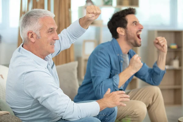 Excited Man Father Couch Watching Football Game — Stock fotografie