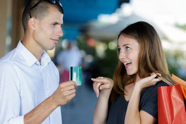 Couple Out Shopping Woman Asking Man Credit Card — 스톡 사진