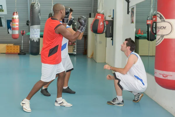 Boxer Men Doing Exercise Punching Bag — 图库照片