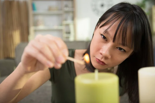 Woman Lighting Candle Candle — Fotografia de Stock