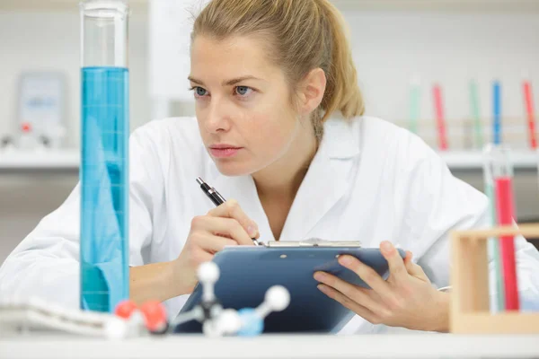 Positive Minded Woman Looking Test Tube — Stock Photo, Image