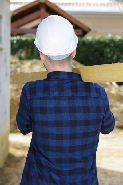 Carpenter Carrying Large Wood Plank His Shoulder — Stock Photo, Image