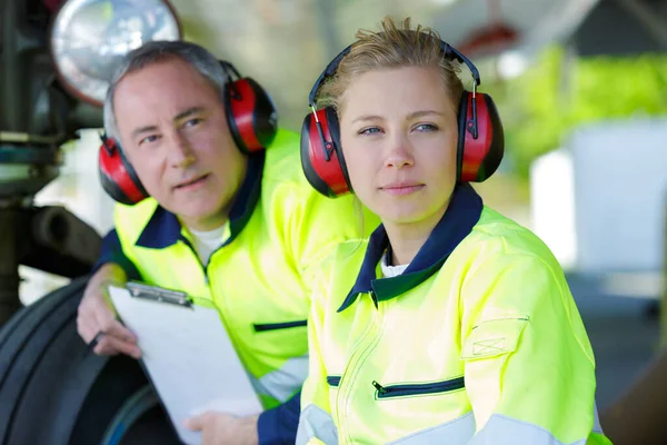 two modern aircraft engineers at work