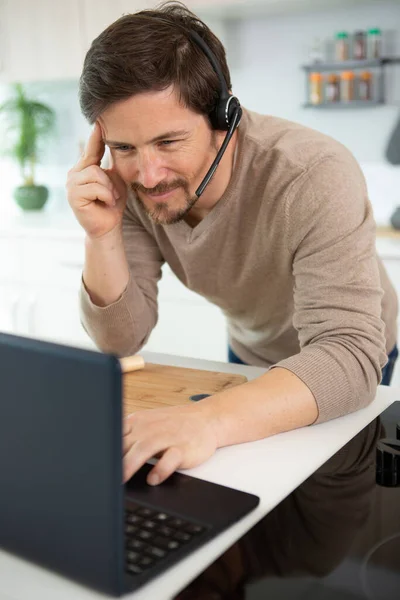 Handsome Man Working Computer Headset His Kitchen — Stock Photo, Image