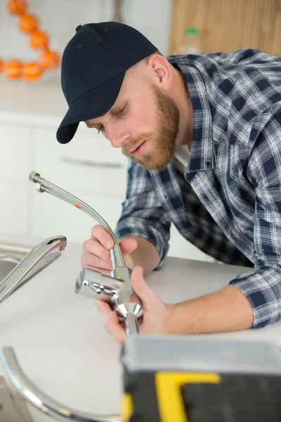 Young Plumber Installing Tap Kitchen — Foto de Stock