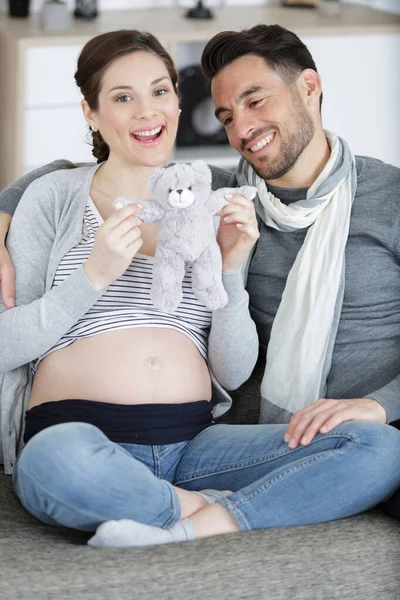 Pregnant Couple Holding Soft Teddy Bear — Foto de Stock