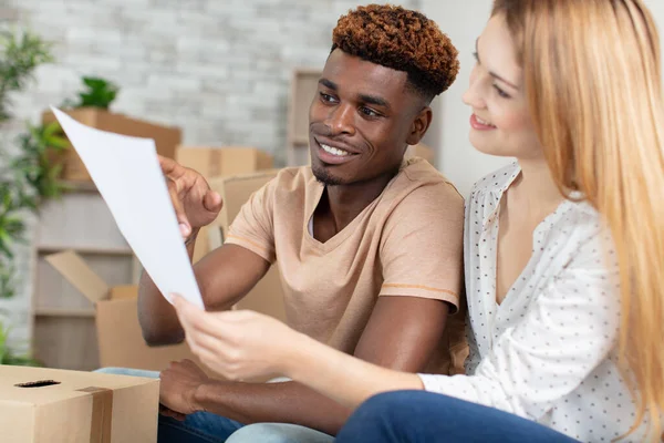 Multi Ethnic Couple Having Break While Moving New Home — Stock Photo, Image