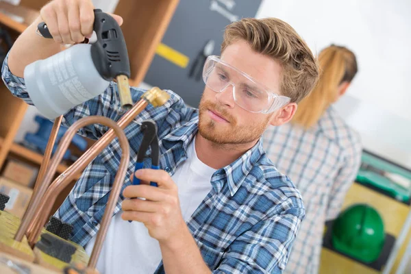 Plumber Soldering Pipe Young — Stock Photo, Image