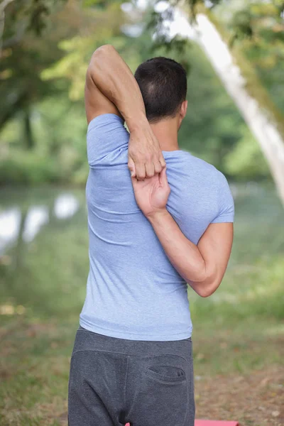 Young Handsome Runner Stretching Nature — Stock Photo, Image