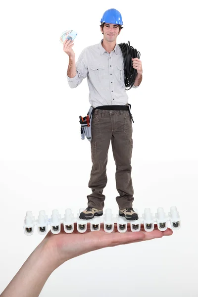 Electrician holding coil of wiring — Stock Photo, Image