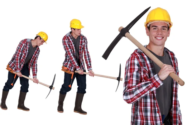 Construction worker with a pickaxe — Stock Photo, Image