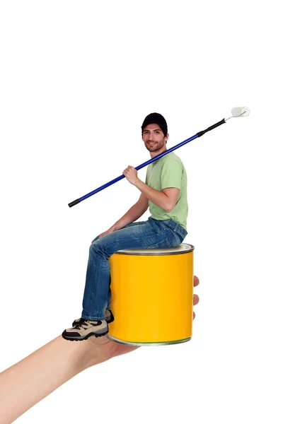 Man sat on paint tin — Stock Photo, Image