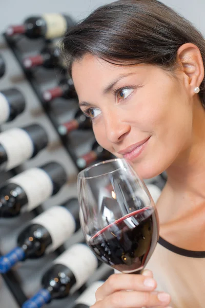 Brunette holding a glass of wine — Stock Photo, Image