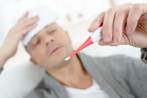 Man running a fever — Stock Photo, Image