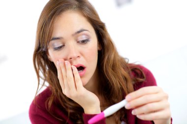 Woman shocked to find out she's pregnant clipart