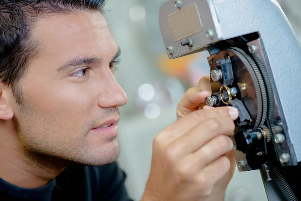 Man adjusting cog — Stock Photo, Image