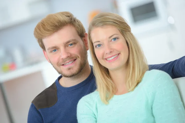 Happy young couple in their first home — Stock Photo, Image