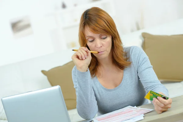 Woman going over her finances — Stock Photo, Image