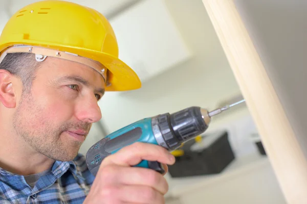 Carpenter drilling — Stock Photo, Image