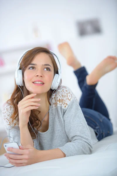 Woman relaxing to some music — Stock Photo, Image
