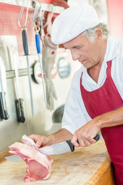 Carefully preparing a cut of beef — Stock Photo, Image