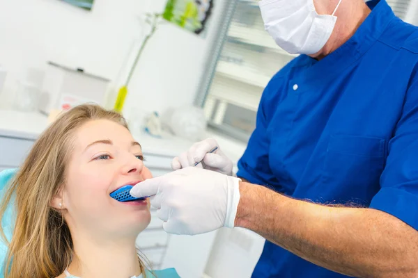 Woman having a routine dental check-up — Stock Photo, Image