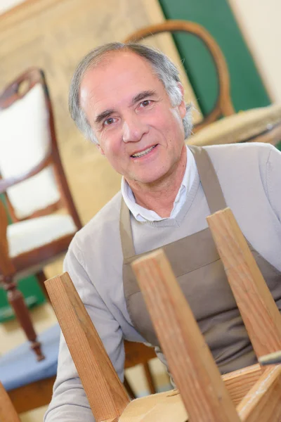 Senior furniture maker and furnishing — Stock Photo, Image