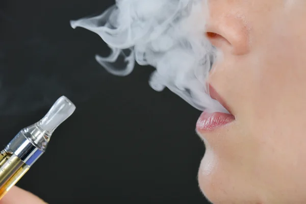 depositphotos_90988278-stock-photo-electronic-cigarette-and-addiction.jpg