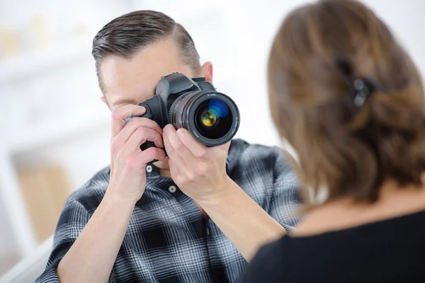 Photographer at work and album — Stock Photo, Image