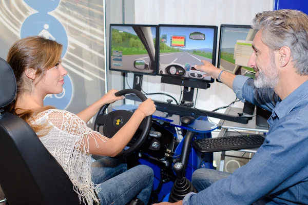 Driving simulator and woman — Stock Photo, Image