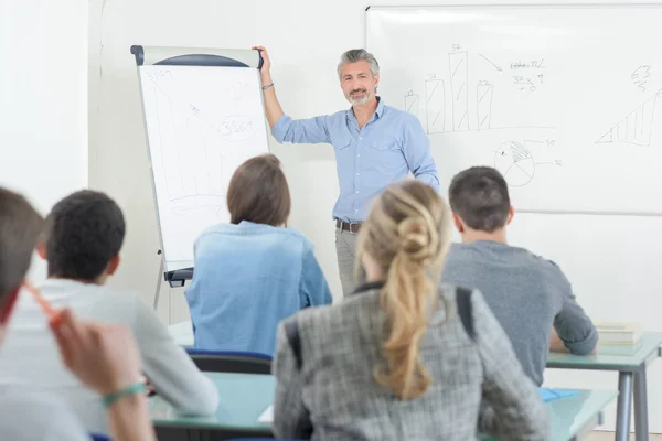 Teacher giving lecture and man — Stock Photo, Image