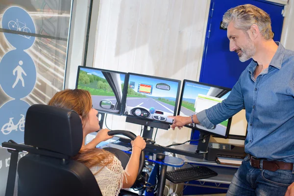 Driving simulator and man — стоковое фото