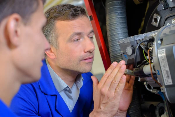 Man working on boiler — Stock Photo, Image