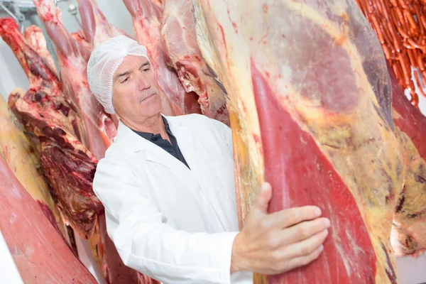 Carne y hombre ahorcados — Foto de Stock