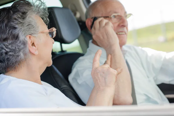 Elderly couple in the car — Stock Photo, Image