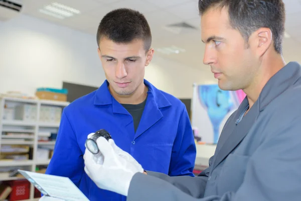 Worker with apprentice and handsome — Stock Photo, Image