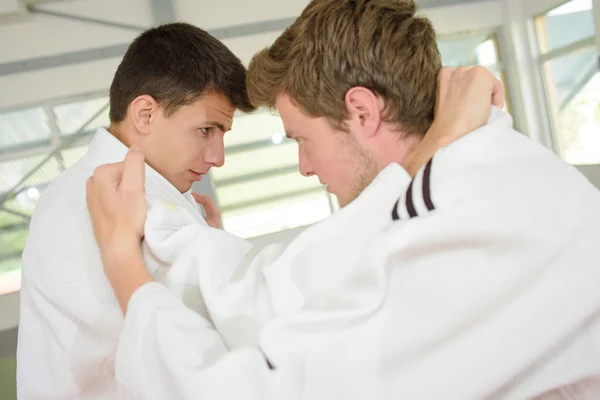 Two young men practicing a martial art — Stock Photo, Image