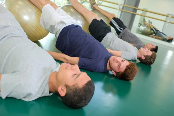 Young men doing exercise — Stock Photo, Image