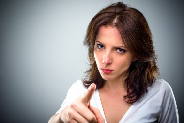 Young woman pointing a finger of blame clipart