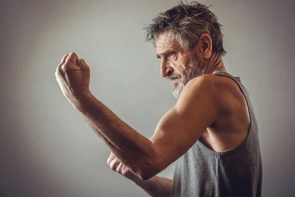 Senior man in fighting position — Stock Photo, Image