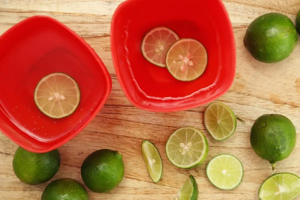 Top view of detox lime water on wooden background — Stock Photo, Image
