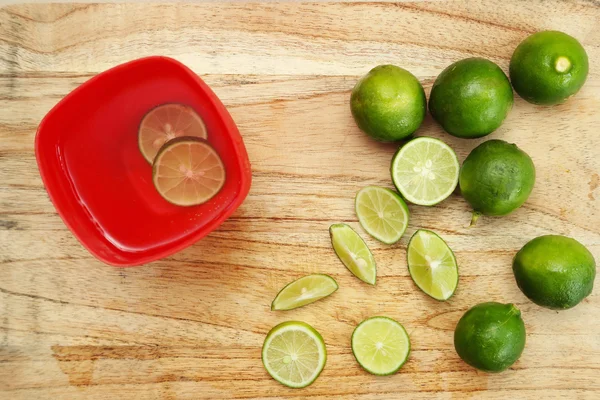 Top view of detox lime water on wooden background — Stock Photo, Image