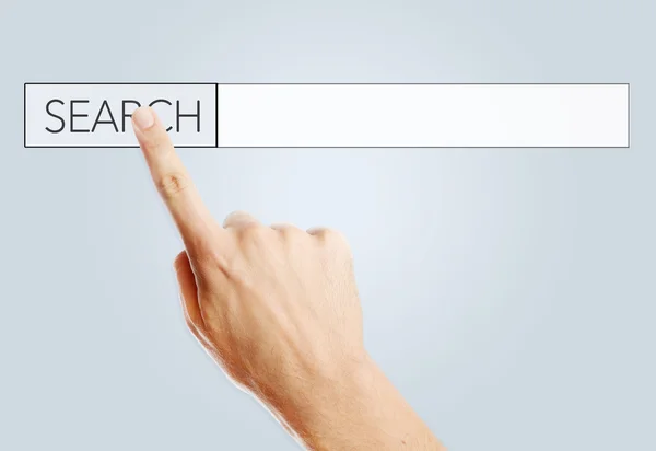 Man touching a search bar on a virtual screen — Stock Photo, Image