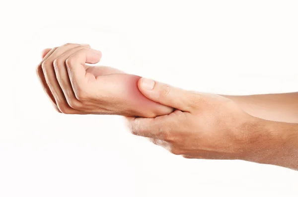 Studio shot of young man with pain in hand — Stock Photo, Image