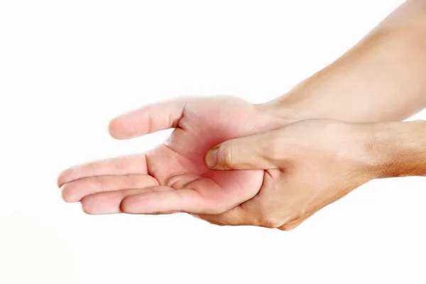 Studio schoot van jonge man met pijn in de hand — Stockfoto