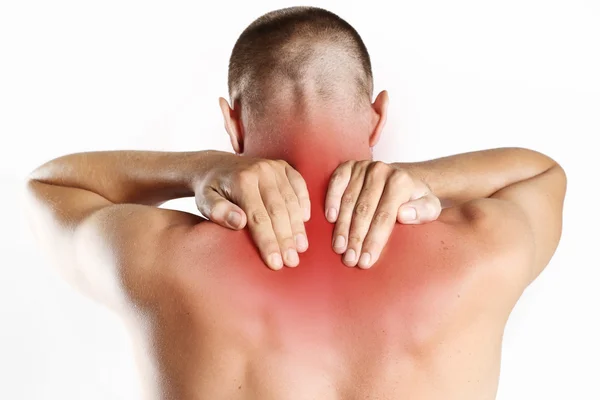 Studioaufnahme eines jungen Mannes mit Schmerzen im Nacken — Stockfoto