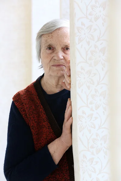 Grandma's portrait - leaning on the old fashioned painted wall — Stock Photo, Image