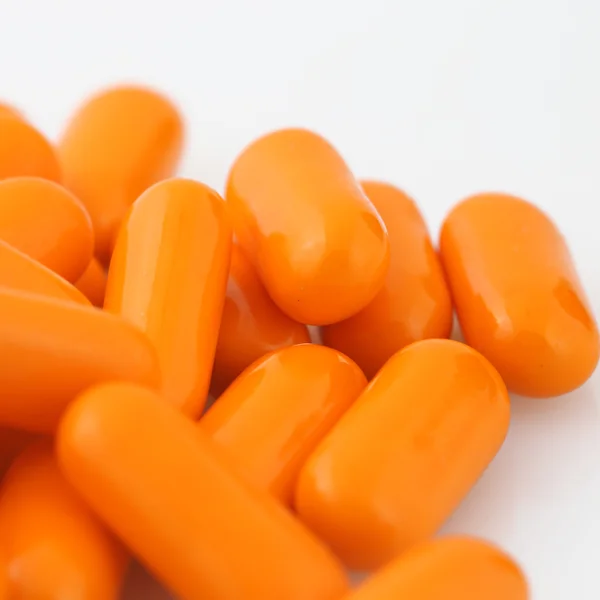 Macro vista de pilha laranja de pílulas — Fotografia de Stock